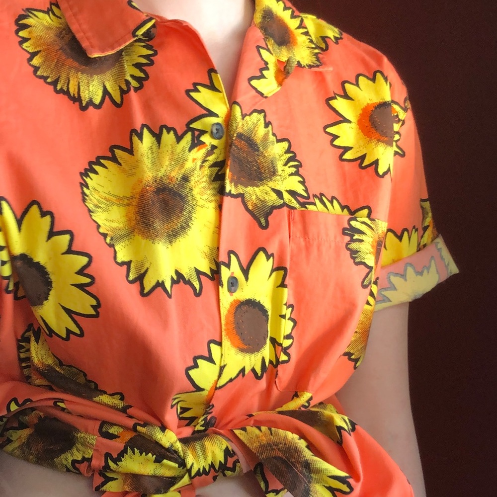 Orange collared button down with sunflowers.